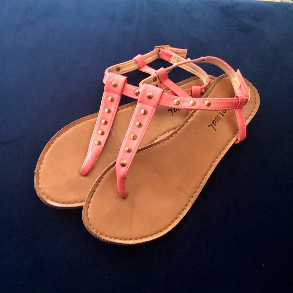 Coral sandals with gold accents